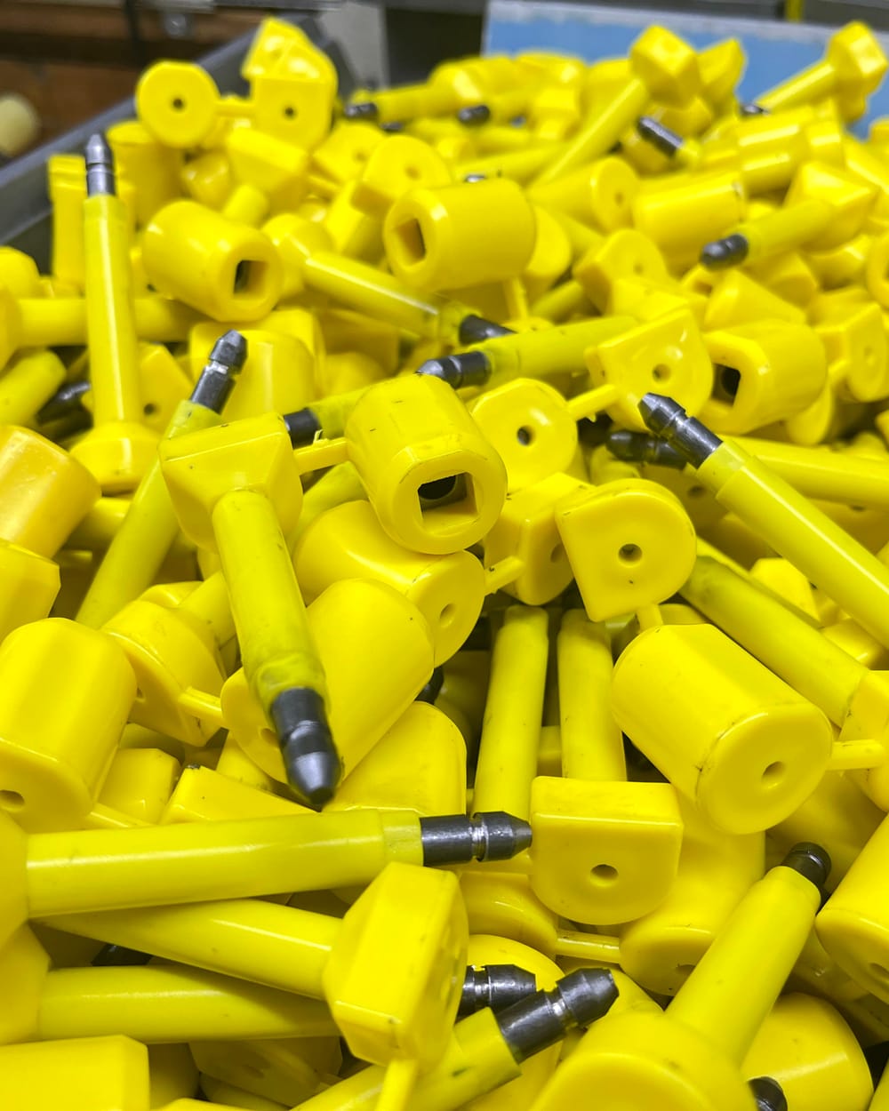 Finished yellow bolt seals with steel pins